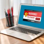 Virus warning alert on computer screen detected modish cyber threat